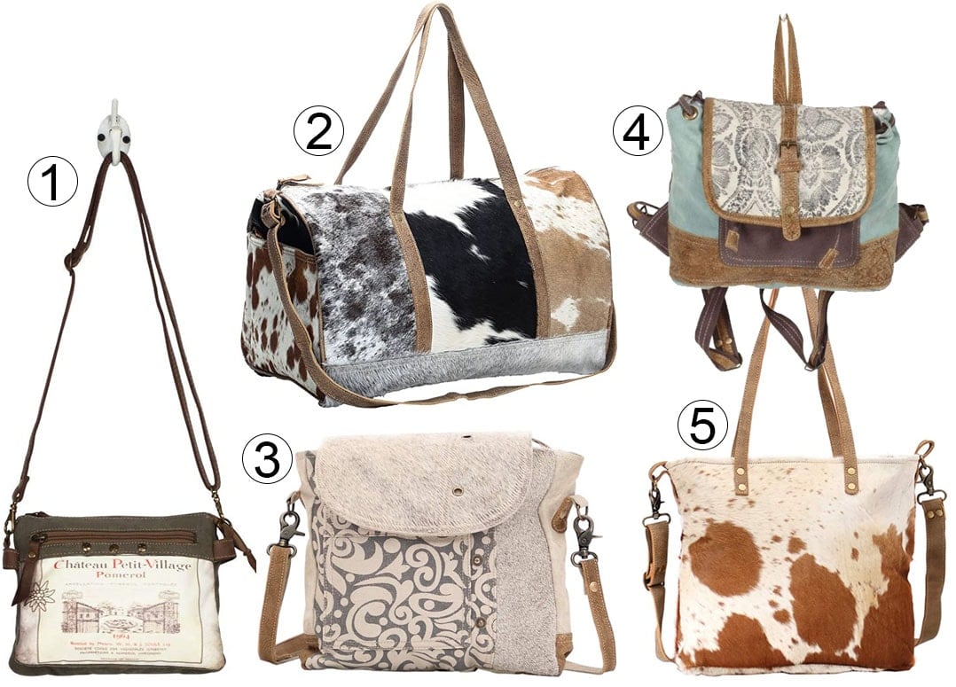1. Myra Bag Pomerol 1964 Upcycled Canvas & Leather Small Crossbody Bag; 2. Myra Bag Cowhide & Leather Travel Bag; 3.Myra Bag Factual Upcycled Canvas & Cowhide Messenger Bag; 4. Myra Bag Solemn Backpack; 5. Myra Bag Camel Upcycled Canvas & Cowhide Tote Bag