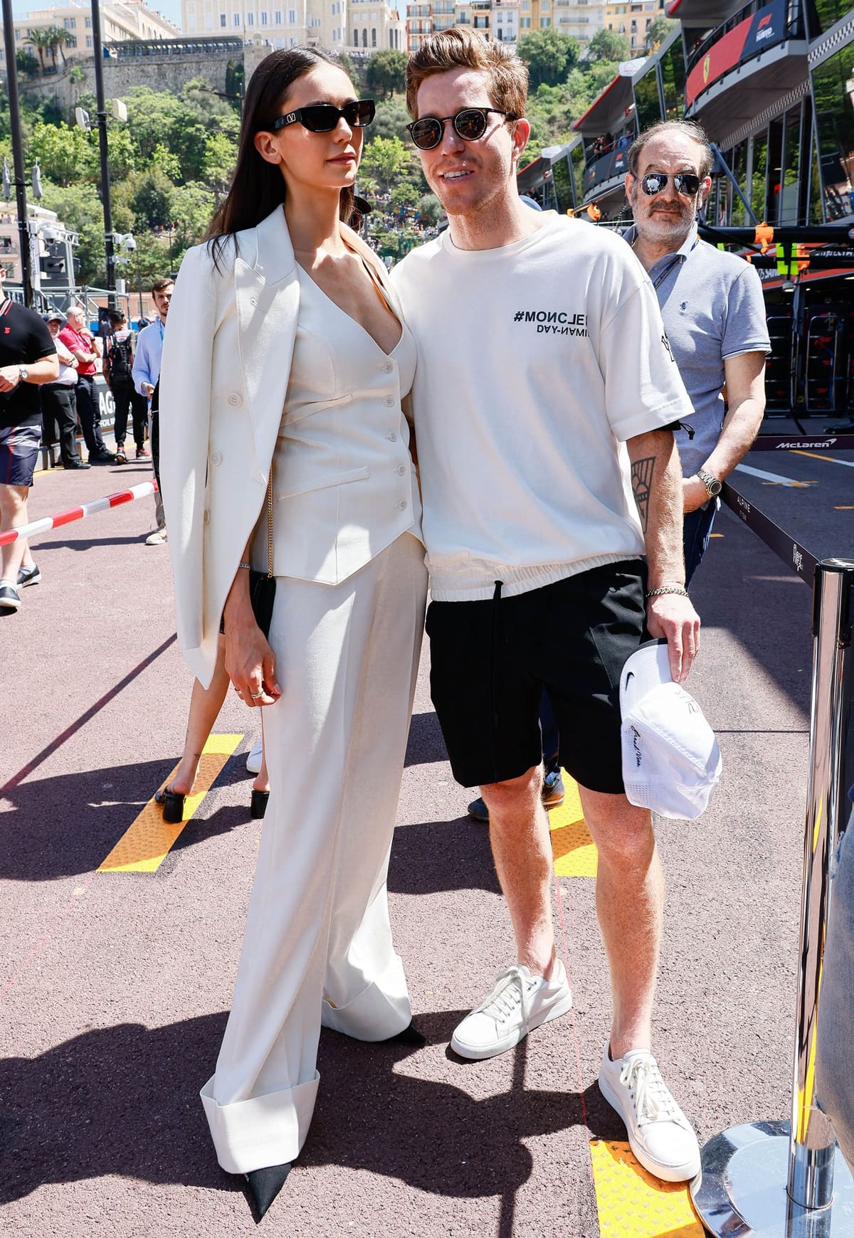 Nina Dobrev, in a white Smythe waistcoat paired with wide-legged cuffed pants, and her boyfriend Shaun White attend qualifying ahead of the F1 Grand Prix of Monaco at Circuit de Monaco