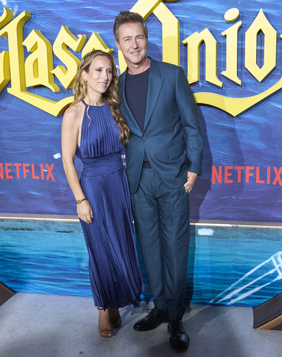 Edward Norton and his wife Shauna Robertson wear matching blue outfits at the Glass Onion Madrid premiere