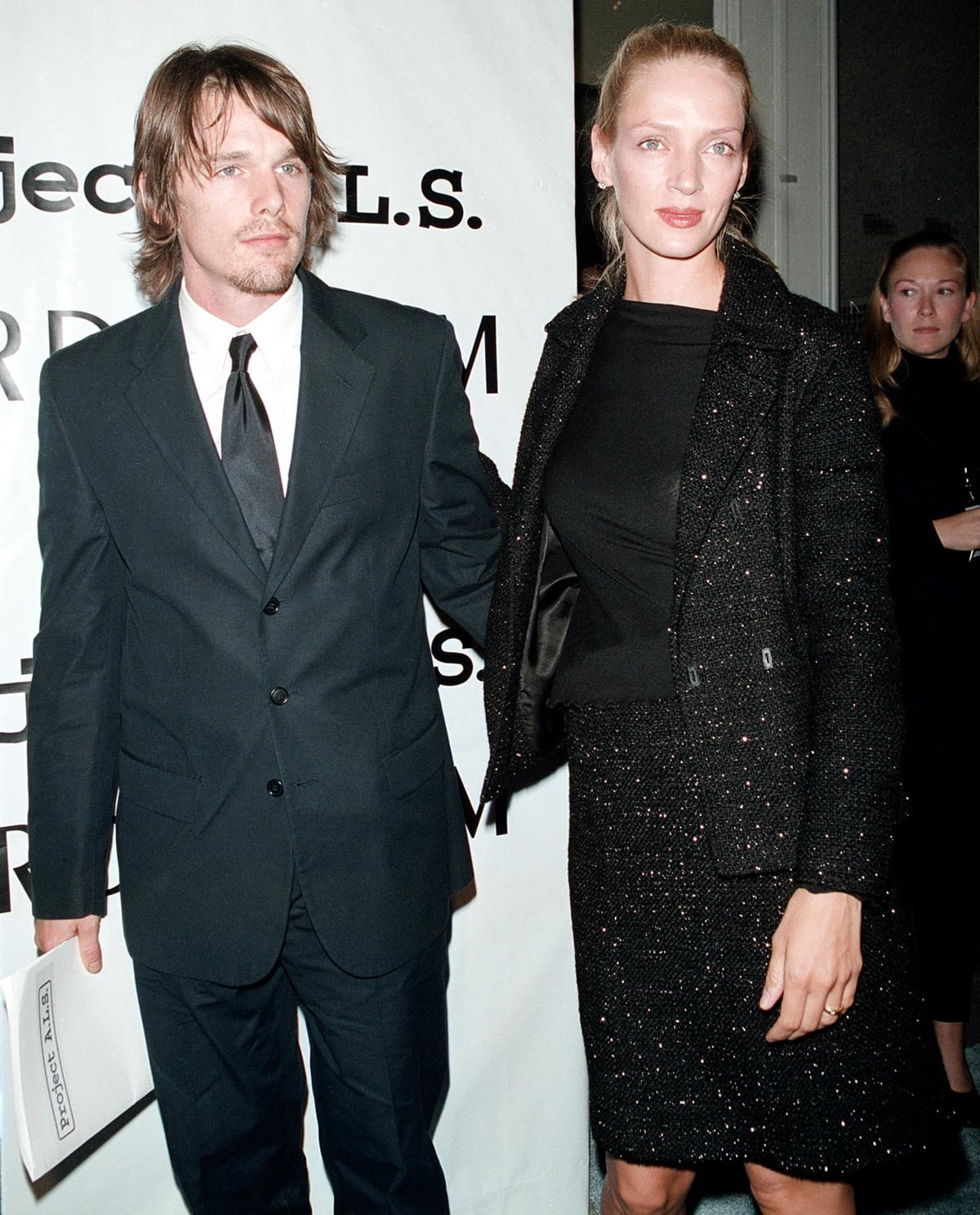 Ethan Hawke and Uma Thurman make a chic statement, with Uma towering in a classic black tweed ensemble that perfectly complements her statuesque frame