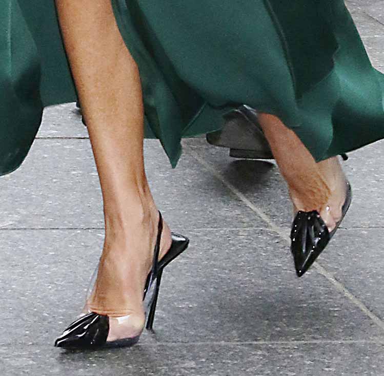 Victoria Beckham slips her feet into Saint Laurent's Chica slingback pumps in black leather and clear PVC