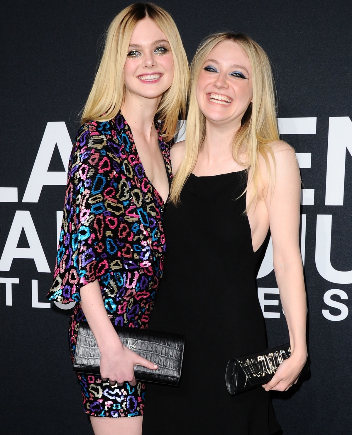 Elle Fanning sparkles in a vibrant animal-print mini dress while Dakota Fanning keeps it chic in a sleek black gown as the stylish sisters light up the red carpet