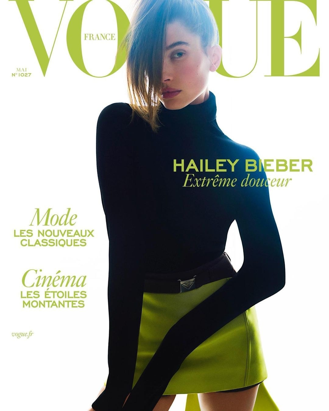 Hailey Bieber was on the cover of Vogue France in May 2022 in a black turtleneck sweater and green miniskirt from Prada's Spring 2022 collection