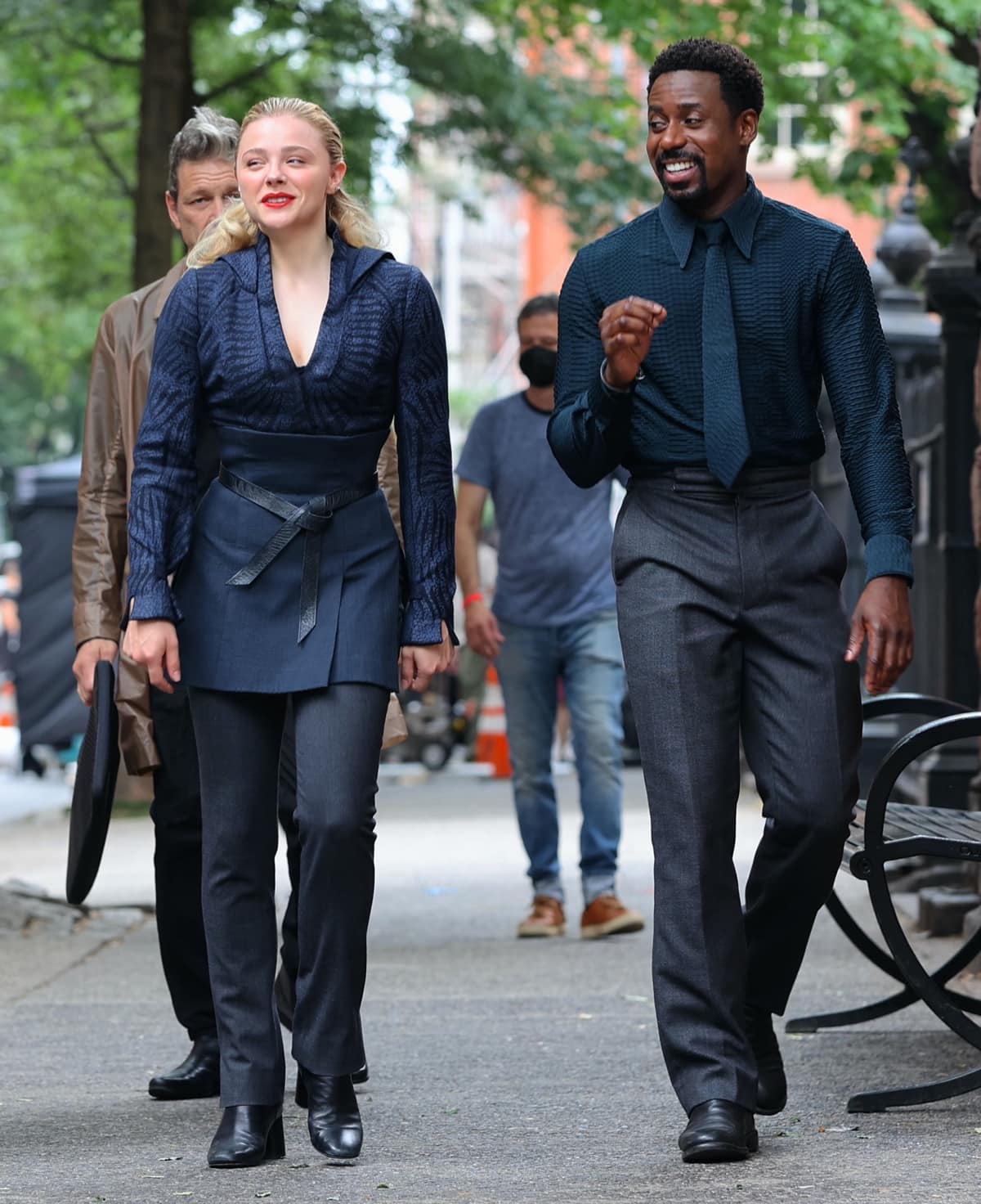 Chloe Grace Moretz and Gary Carr in utilitarian looks seem to have a good time on the set of The Peripheral while filming in New York City