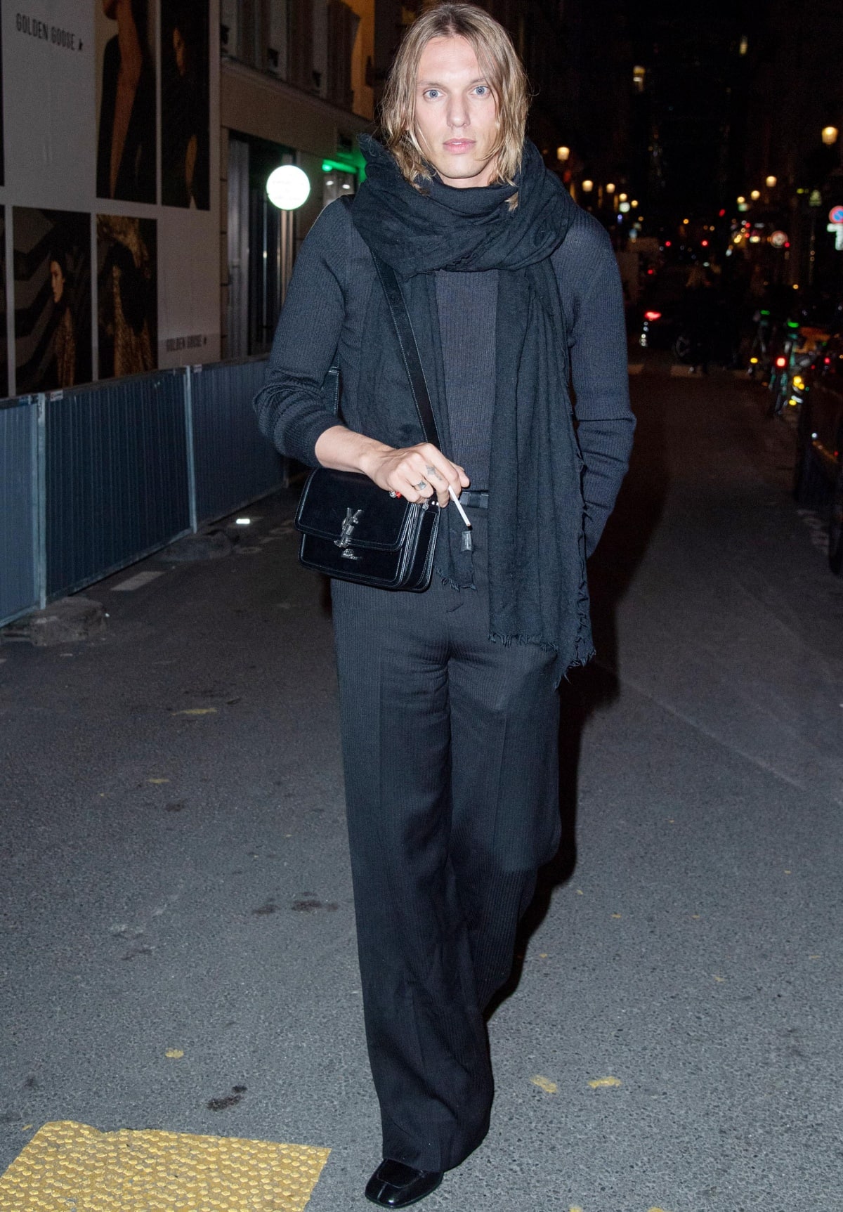 Jamie Campbell Bower attending the Saint Laurent Rive Droite Sushi Park Party during Paris Fashion Week