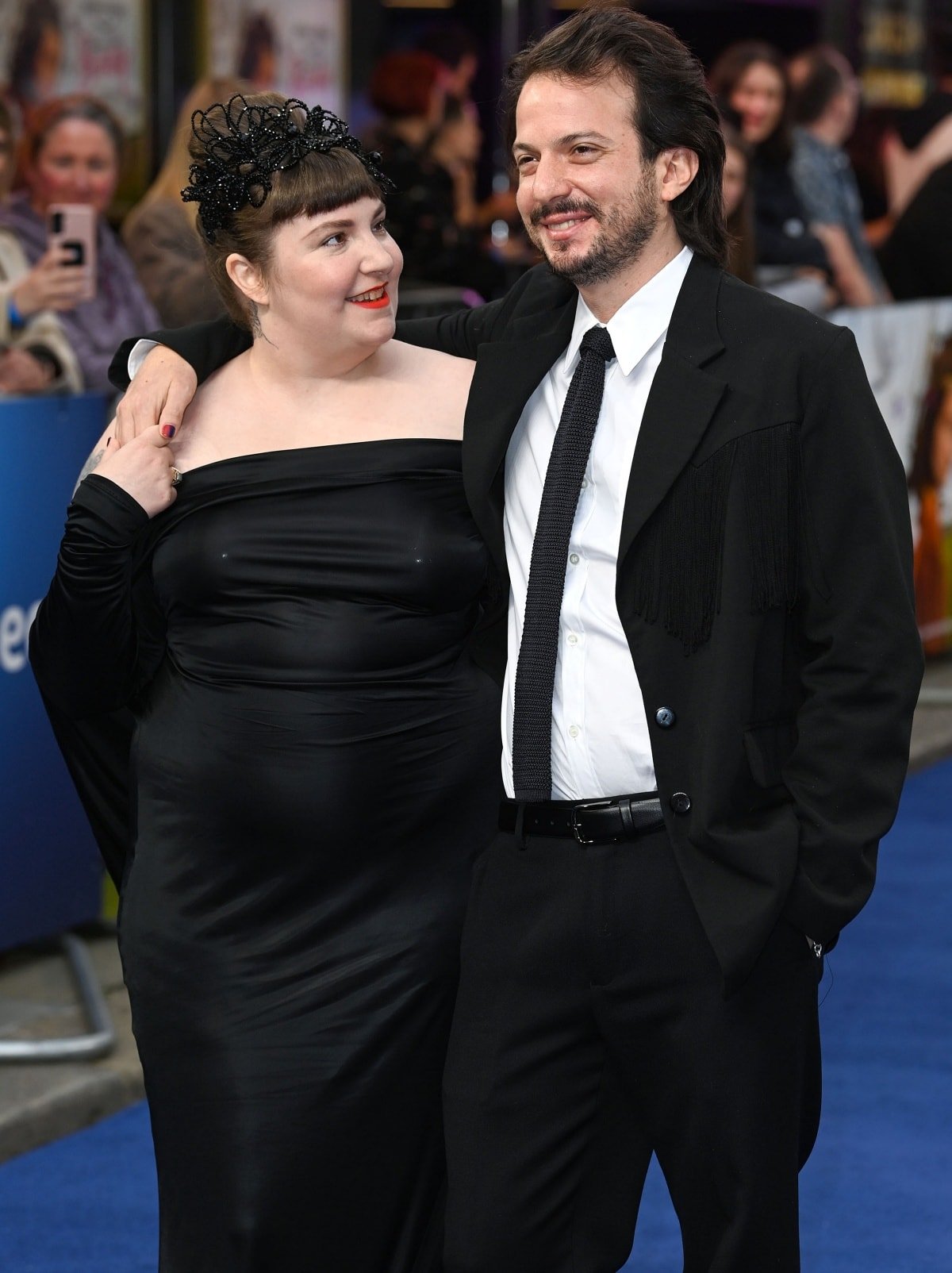 Lena Dunham looking fondly at husband Luis Felber at the premiere of her film, Catherine Called Birdy, in London