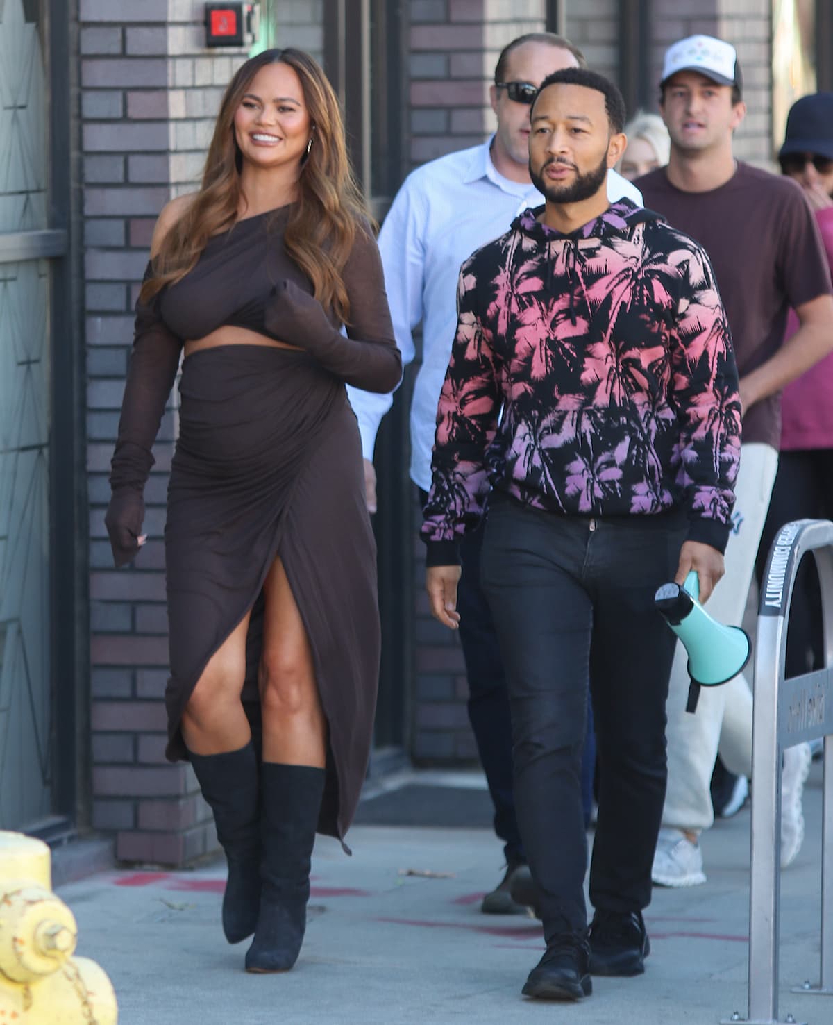 Chrissy Teigen flaunts her growing baby bump in a chocolate brown Rick Owens ensemble