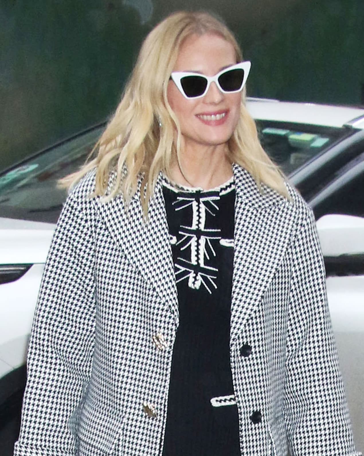 Diane Kruger opts for a retro finish with white cat-eye sunglasses