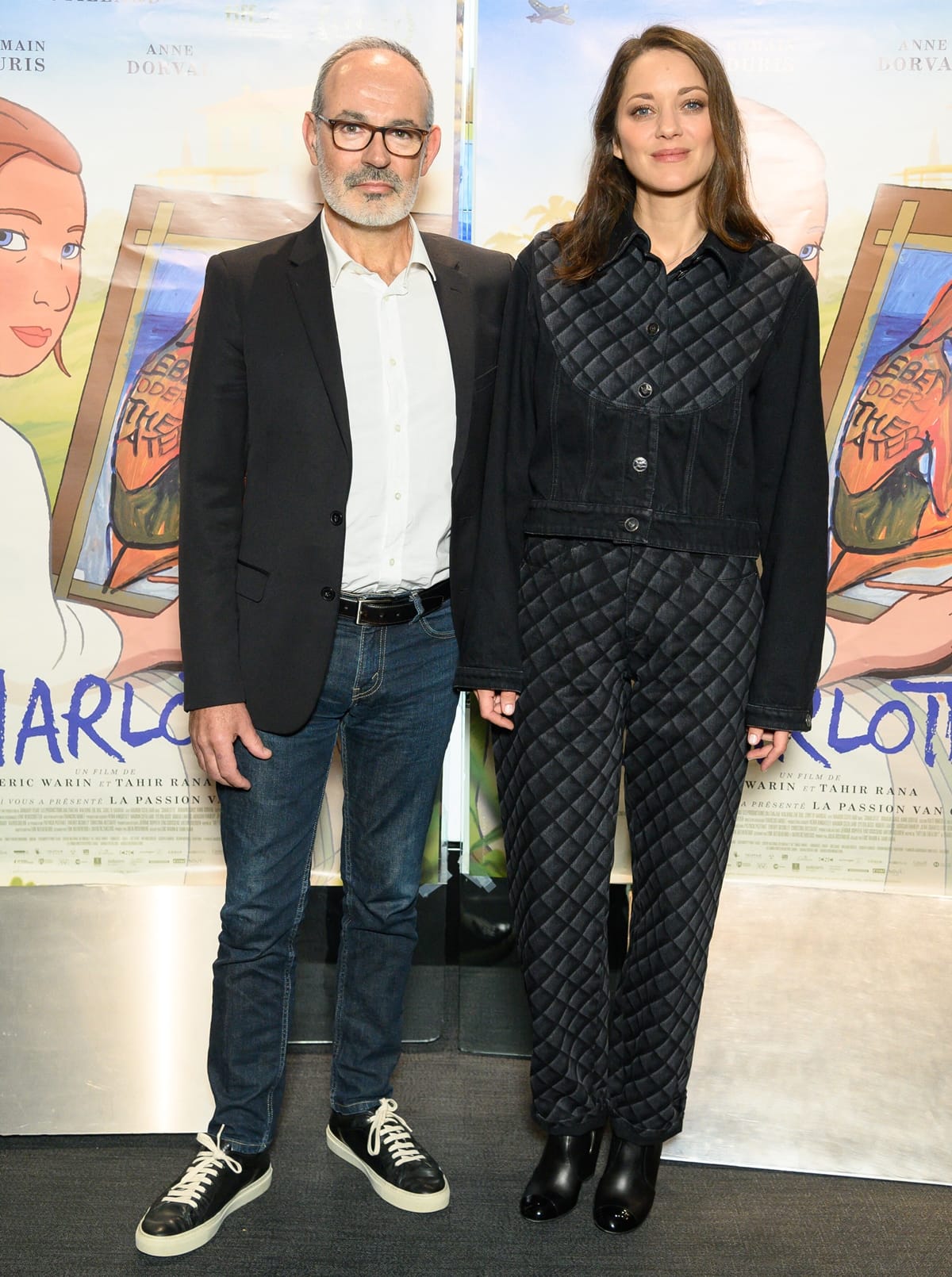 Director Eric Warin keeps it classic in a blazer and jeans, while Marion Cotillard exudes edgy sophistication in a quilted black denim ensemble paired with sleek boots