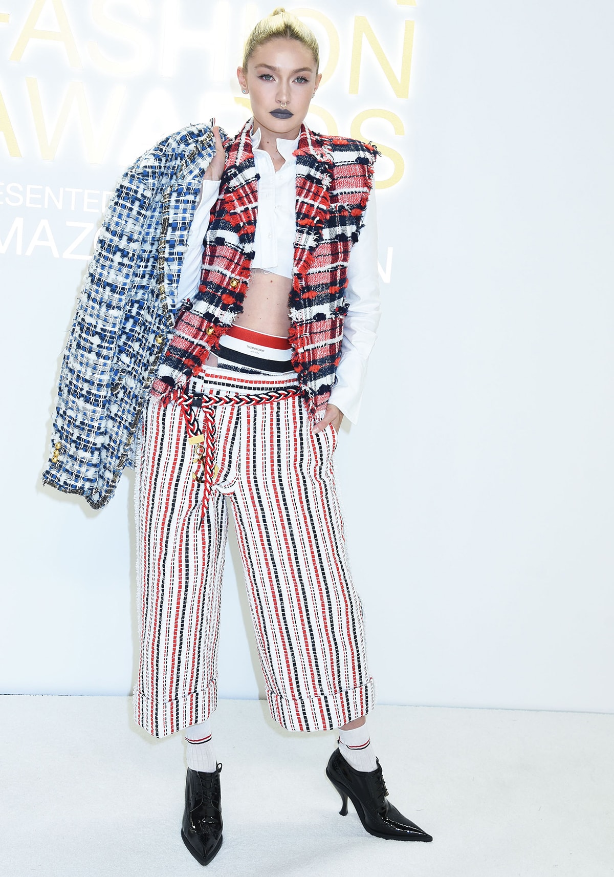 Gigi Hadid leans into glam-punk style in a multipatterned Thom Browne menswear ensemble