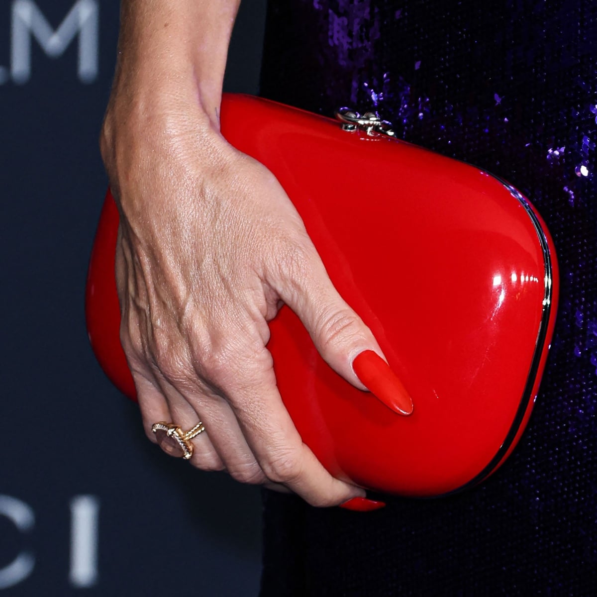 Heidi Klum toted a glossy red Jeffrey Levinson Elina clutch