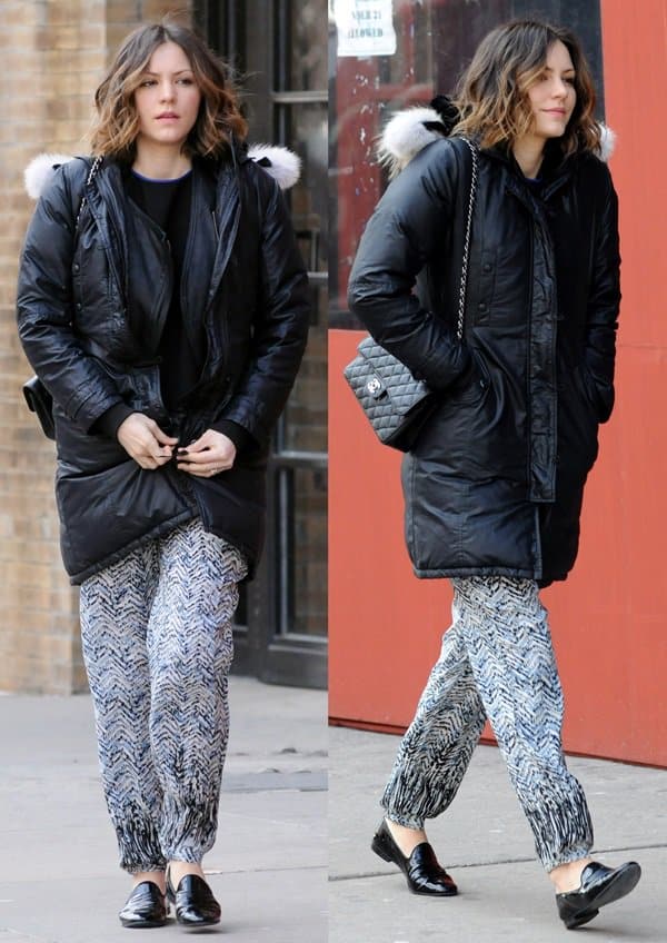 Katharine McPhee keeps it casual and cozy in a black puffer coat paired with relaxed printed silk pants and sleek black loafers while out in Manhattan