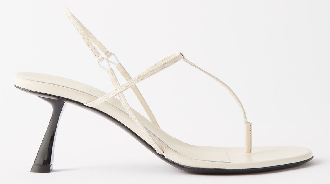 The minimalist Khaite Linden sandals have thin straps and angular stiletto heels