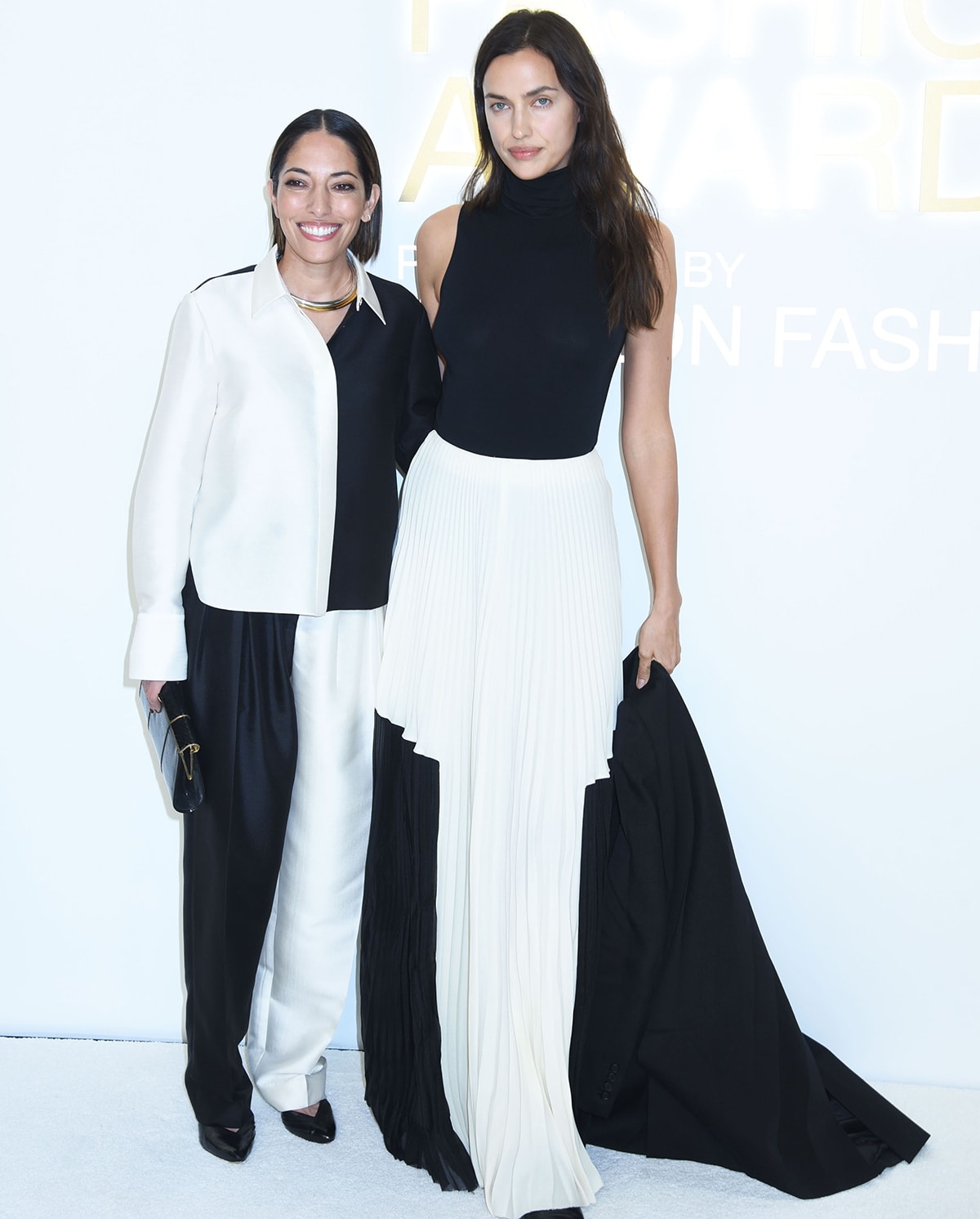 Bare-faced Irina Shayk poses with fashion designer Nellie Partow