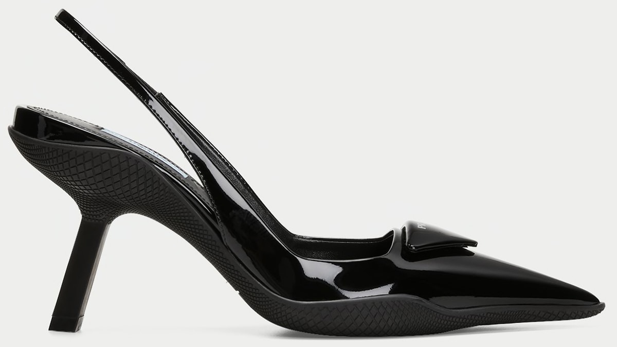 These Prada pumps feature a logo triangle accent at the vamp and a sporty rubber sole