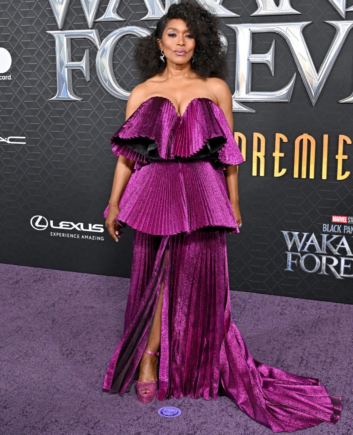 Angela Bassett wearing a custom Moschino strapless gown and Le Silla heels