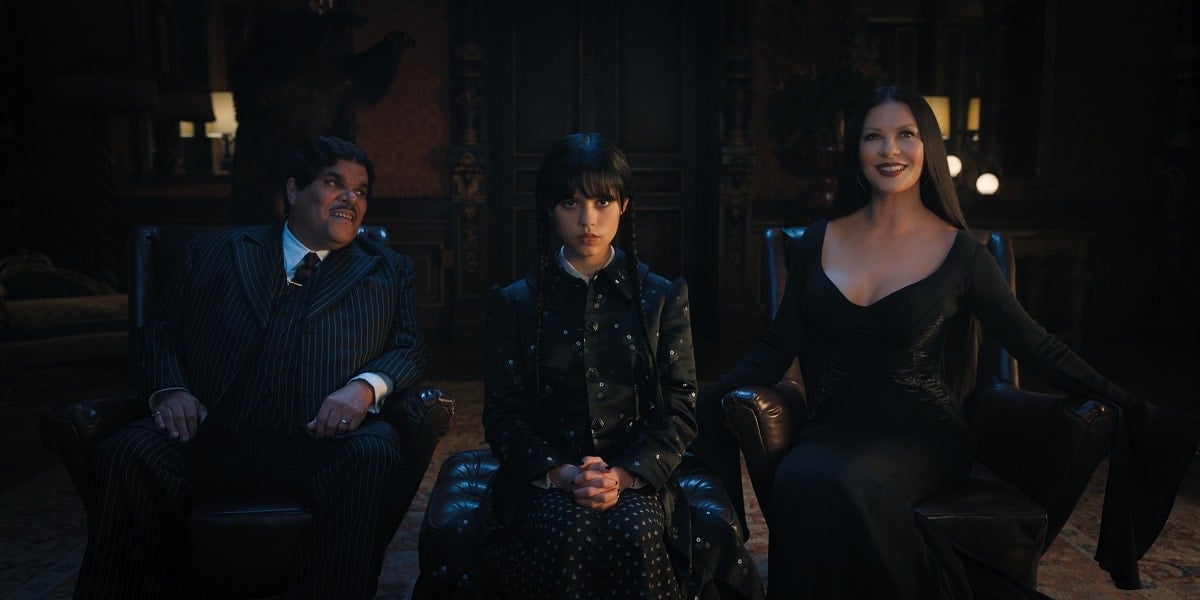 Luis Guzman as Gomez Addams, Jenna Ortega as Wednesday Addams, and Catherine Zeta-Jones as Morticia Addams in the 2022 coming-of-age supernatural horror comedy television series Wednesday