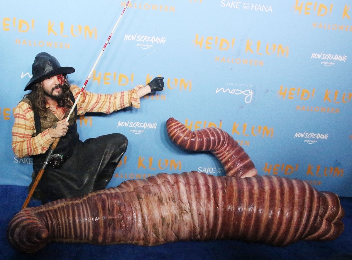 Tom Kaulitz with a gouged eye and a fishing pole taking his bait, the completely unrecognizable Heidi Klum as a rain worm