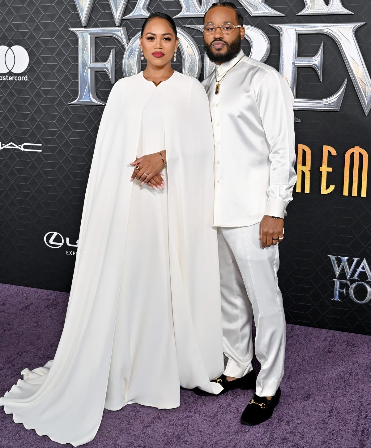 Zinzi Evans and Ryan Coogler wearing all-white ensembles at the Black Panther: Wakanda Forever Los Angeles premiere
