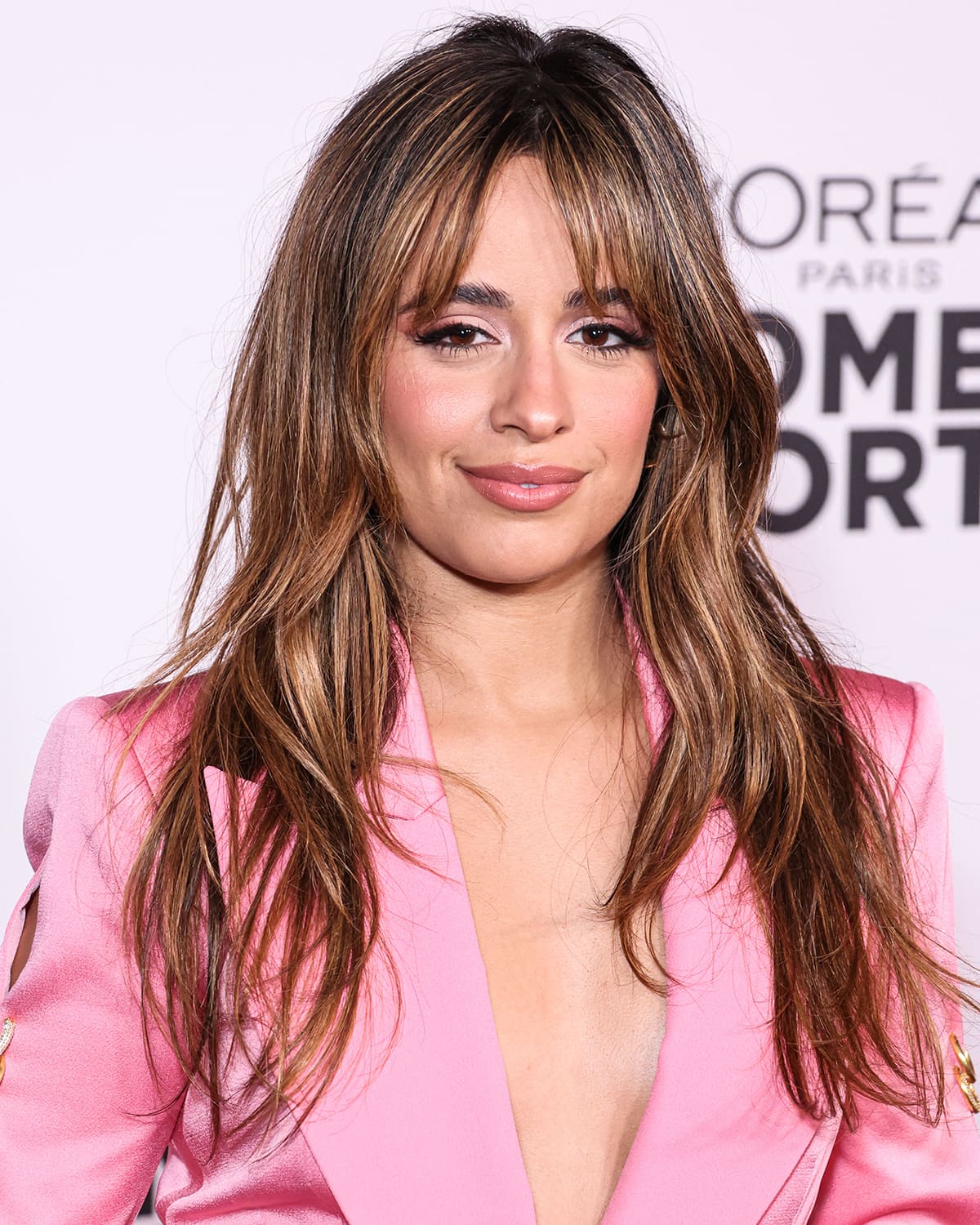 Camila Cabello keeps the look sexy with sultry waves hairstyle and light pink smokey eye makeup