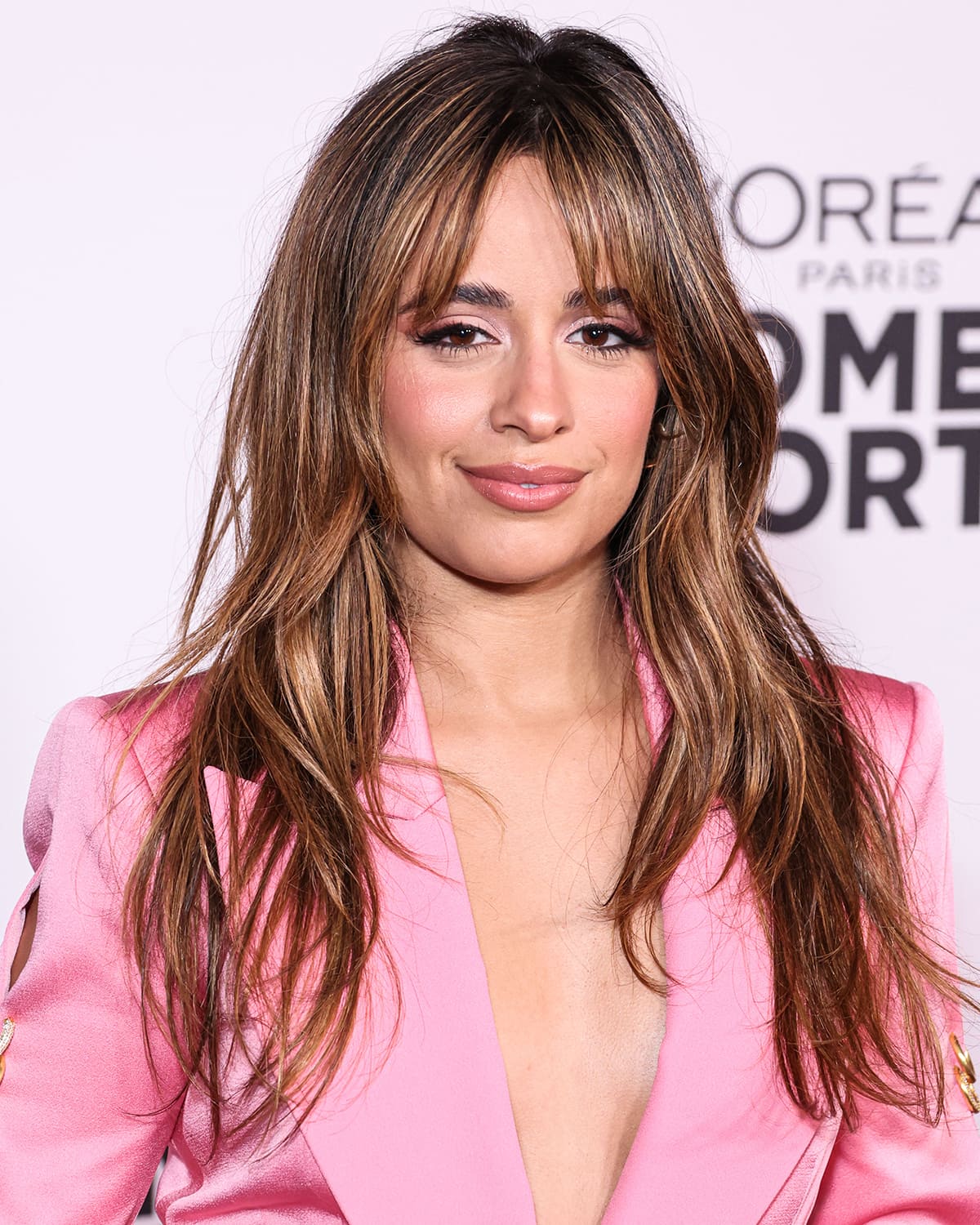 Camila Cabello keeps the look sexy with sultry waves hairstyle and light pink smokey eye makeup