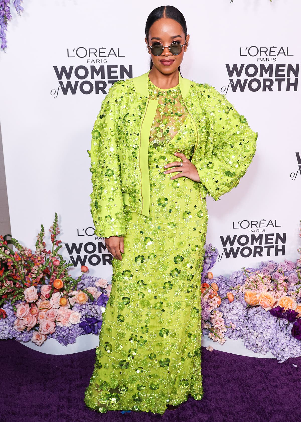 H.E.R. wears a striking lime green floral sequin-embellished gown and a matching jacket by Elie Saab