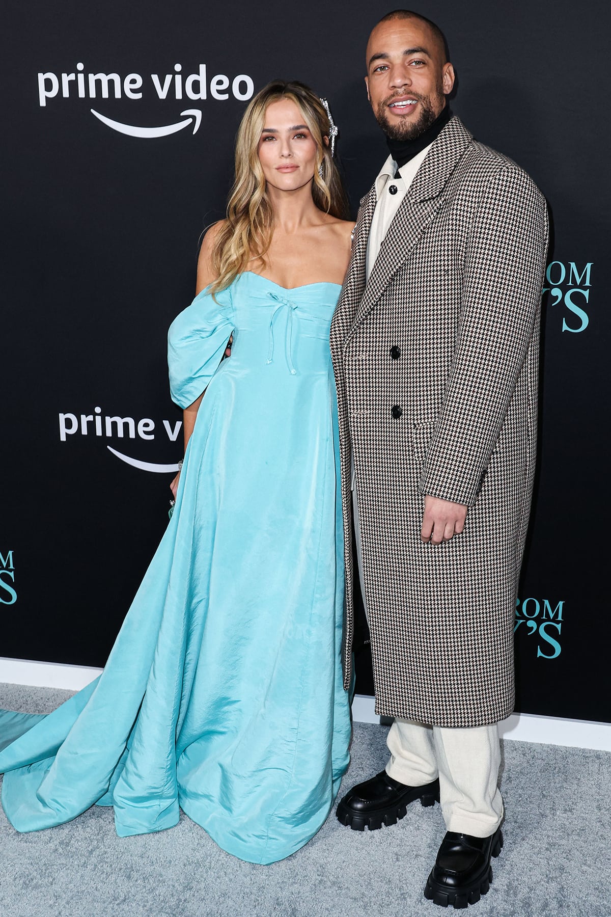 Lead star Kendrick Sampson wears a houndstooth-patterned coat with a cream-colored coat and a black turtleneck top