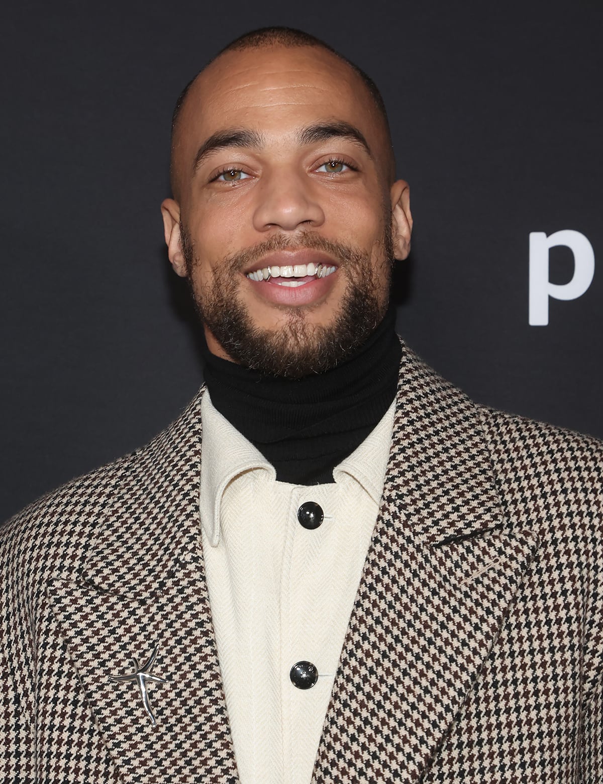 Kendrick Sampson styles his look with an Elsa Peretti Starfish brooch and a couple of Tiffany rings