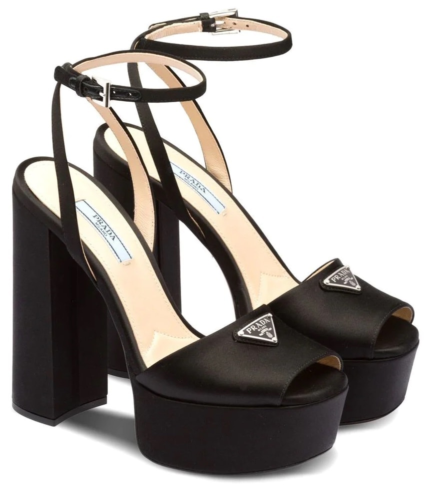 These satin sandals boast Prada's triangle logo, thick platforms, and block heels