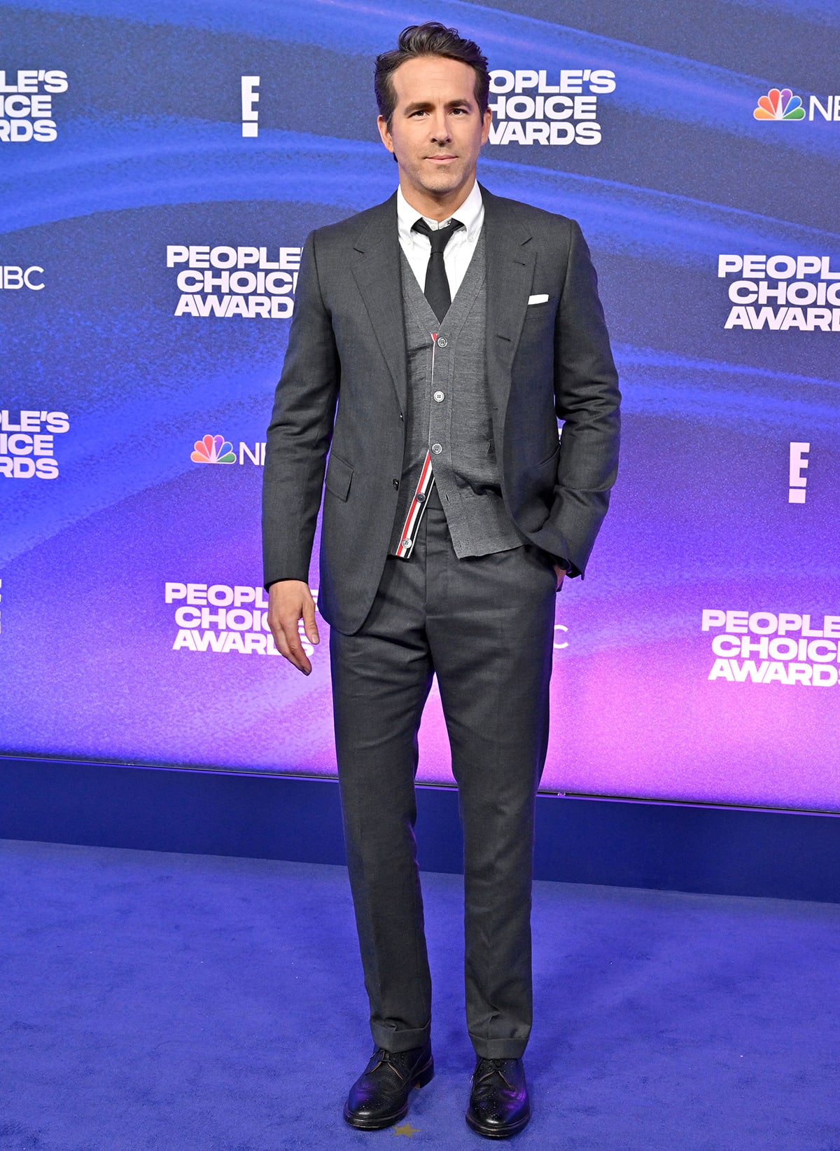 People's Icon honoree Ryan Reynolds looks dapper in a three-piece dark gray suit by Thom Browne