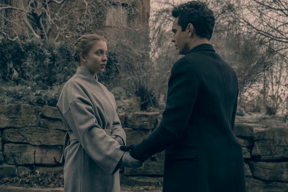 Sydney Sweeney portrays Eden Blaine, an obedient young girl who is assigned to be a child bride for Nick Blaine (Max Minghella) in the American dystopian television series The Handmaid's Tale