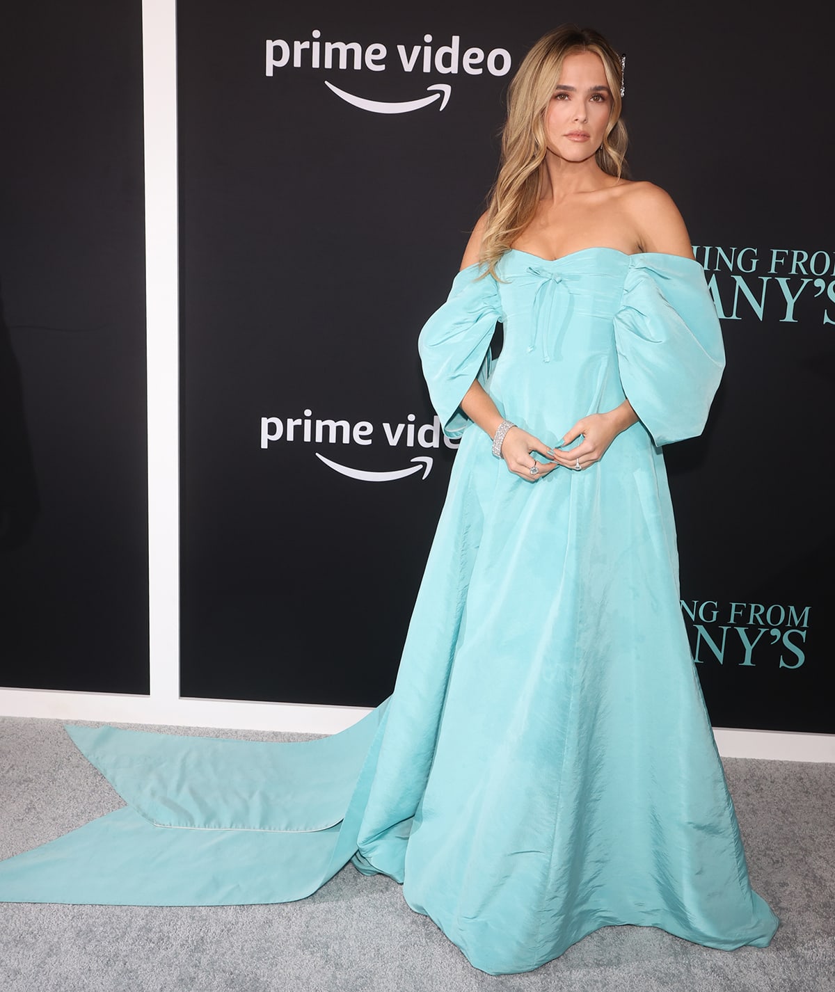 Zoey Deutch channels Cinderella in a tiffany blue Carolina Herrera gown with off-the-shoulder balloon sleeves and a dramatic train