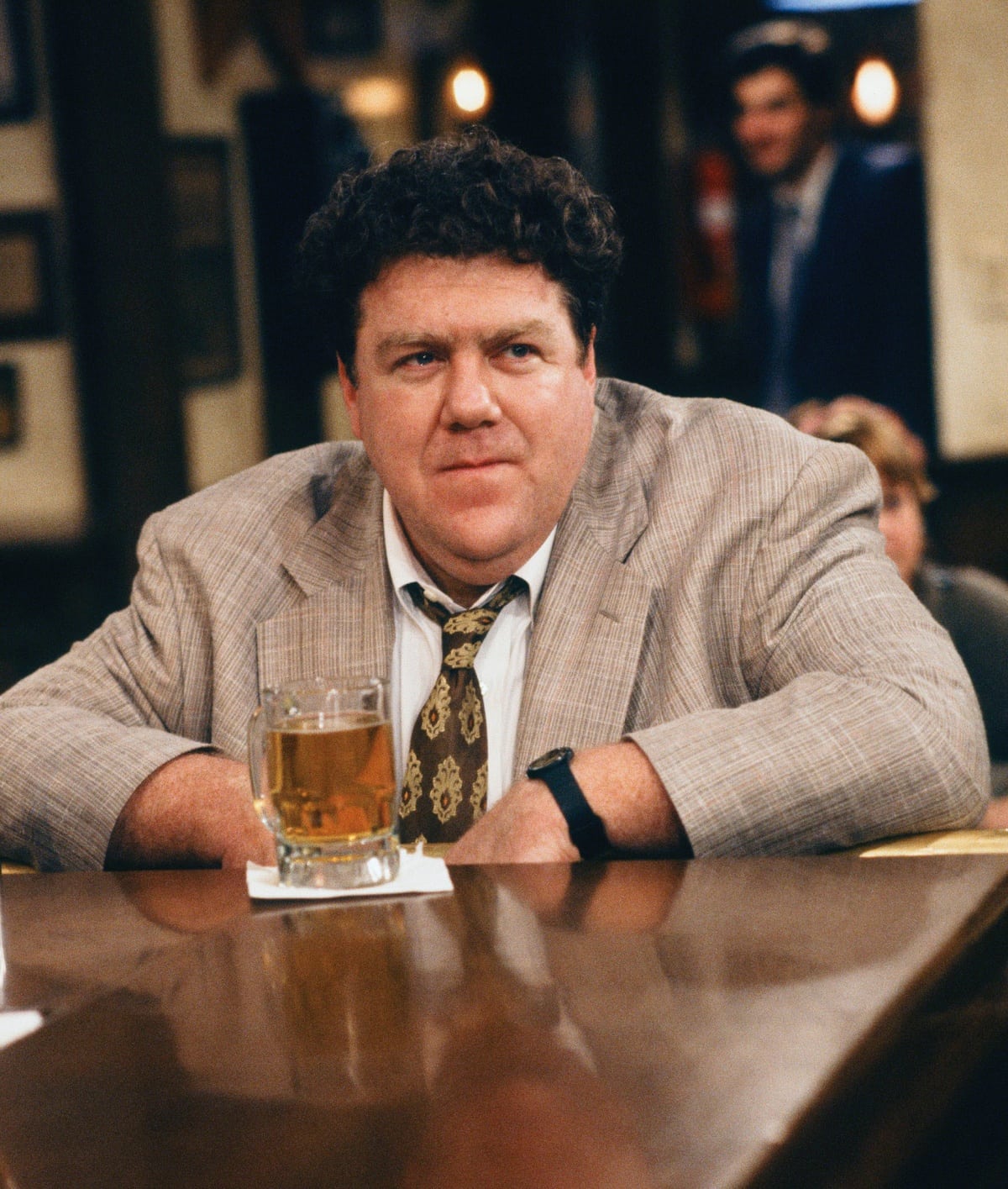 George Wendt as Norm Peterson in the popular sitcom television series Cheers