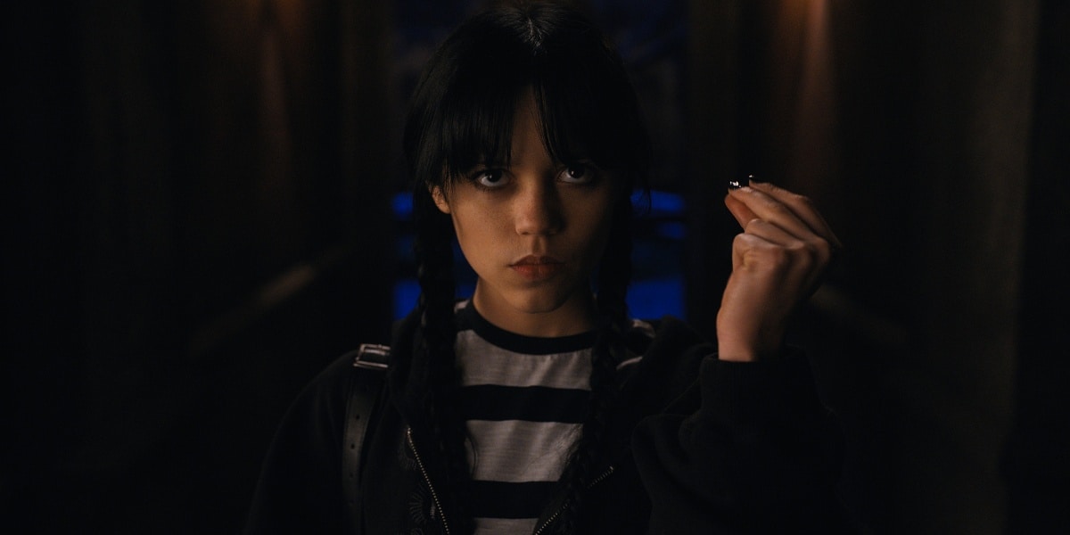 Jenna Ortega doing the infamous Addams Family snap in the delightfully sinister Netflix series, Wednesday