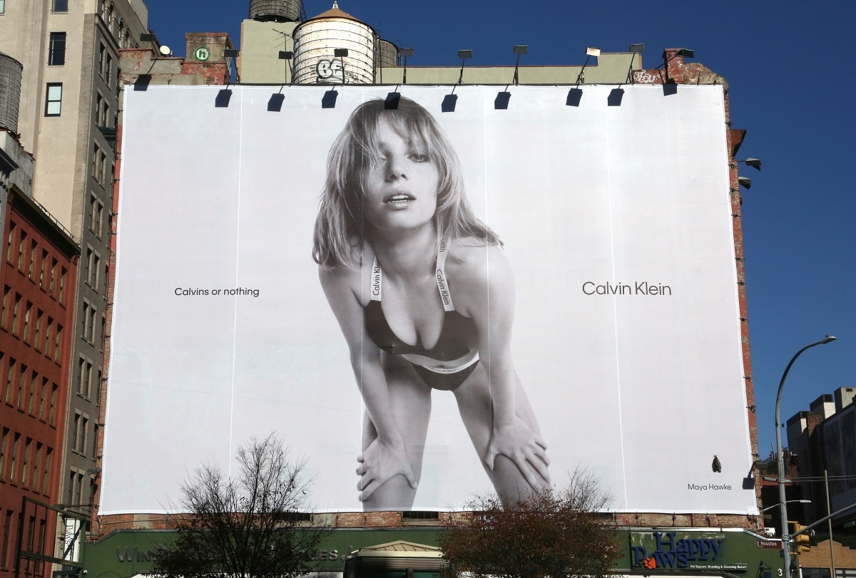 A Calvin Klein advertisement billboard featuring Maya Hawke in Soho in New York
