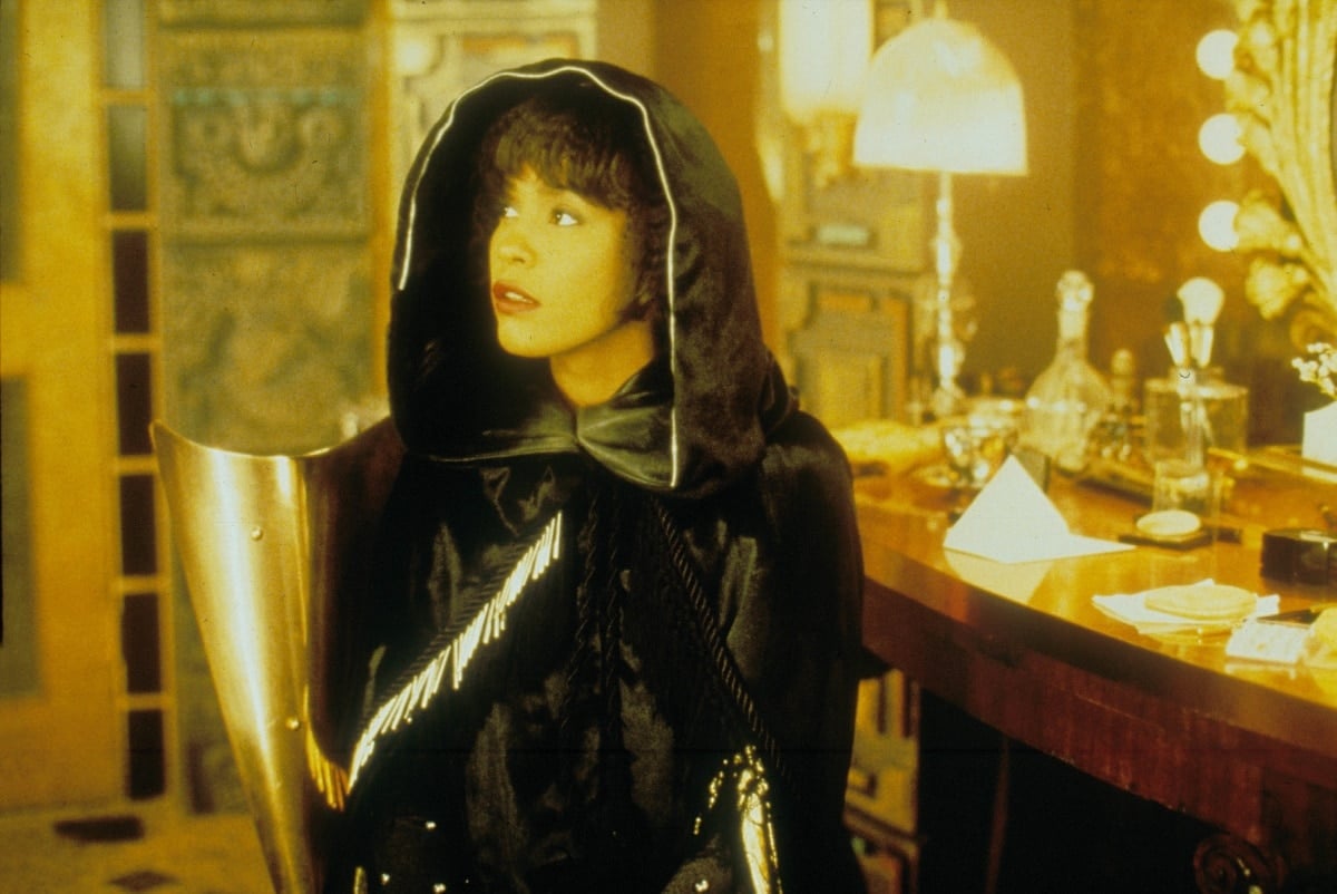 Whitney Houston as Rachel Marron wearing the iconic cape in the 1992 romantic drama thriller film The Bodyguard