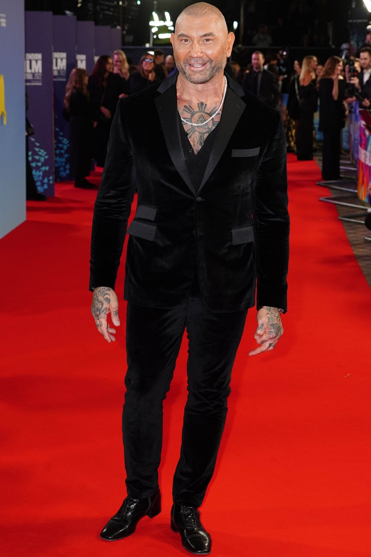 During the BFI London Film Festival on October 16, 2022, Dave Bautista, who stands at an impressive height of 6'2 ¾" (189.9 cm), made a striking appearance at the premiere of "Glass Onion: A Knives Out Mystery"