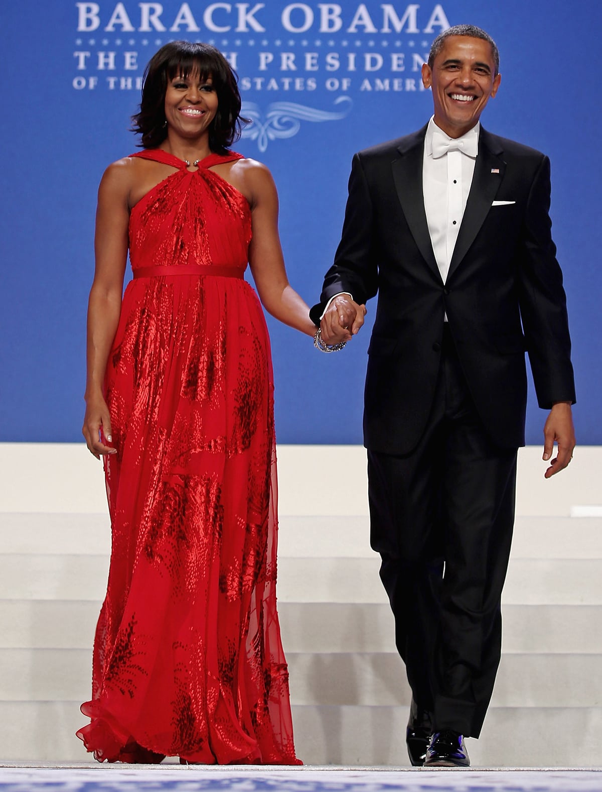Michelle Obama arriving at the 2013 Inaugural Ball in a red Jason Wu gown with her husband Barack Obama held at the Walter Washington Convention Center on January 21, 2013