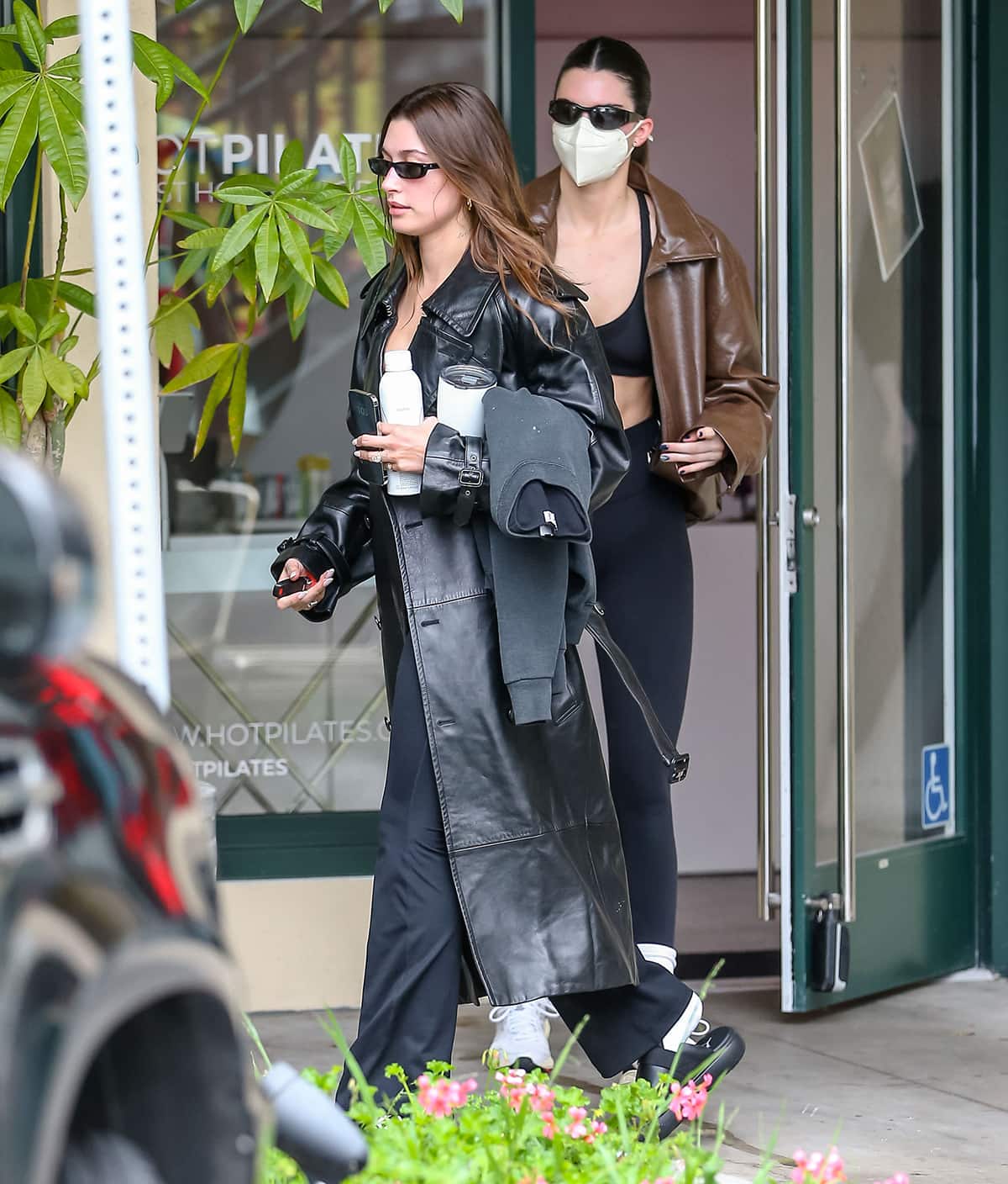Hailey Bieber and Kendall Jenner wear leather coats to Pilates class at Get Hot in West Hollywood on January 3, 2023