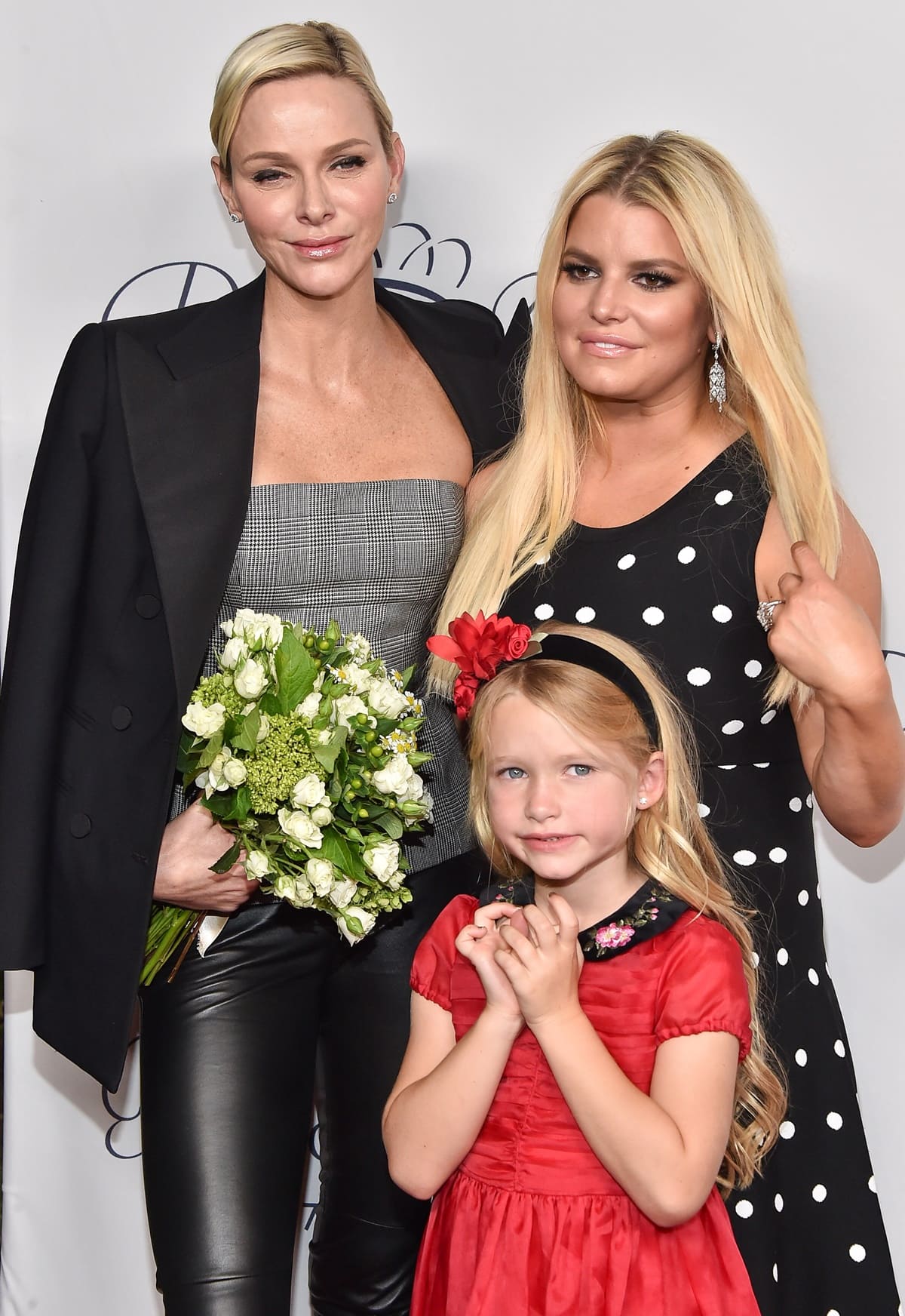 Her Serene Highness Princess Charlene of Monaco, Jessica Simpson, and Maxwell Johnson attend the 2017 Princess Grace Awards