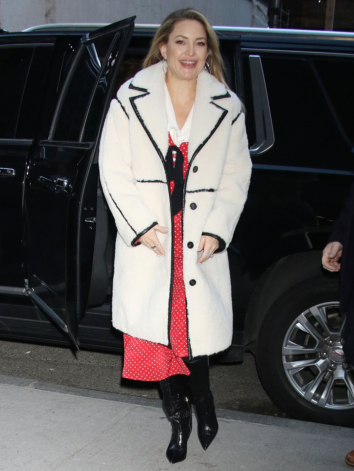 Kate Hudson arrives at The Today Show studios in a retro red polka dot dress by Alessandra Rich and a faux sheepskin coat by Maje