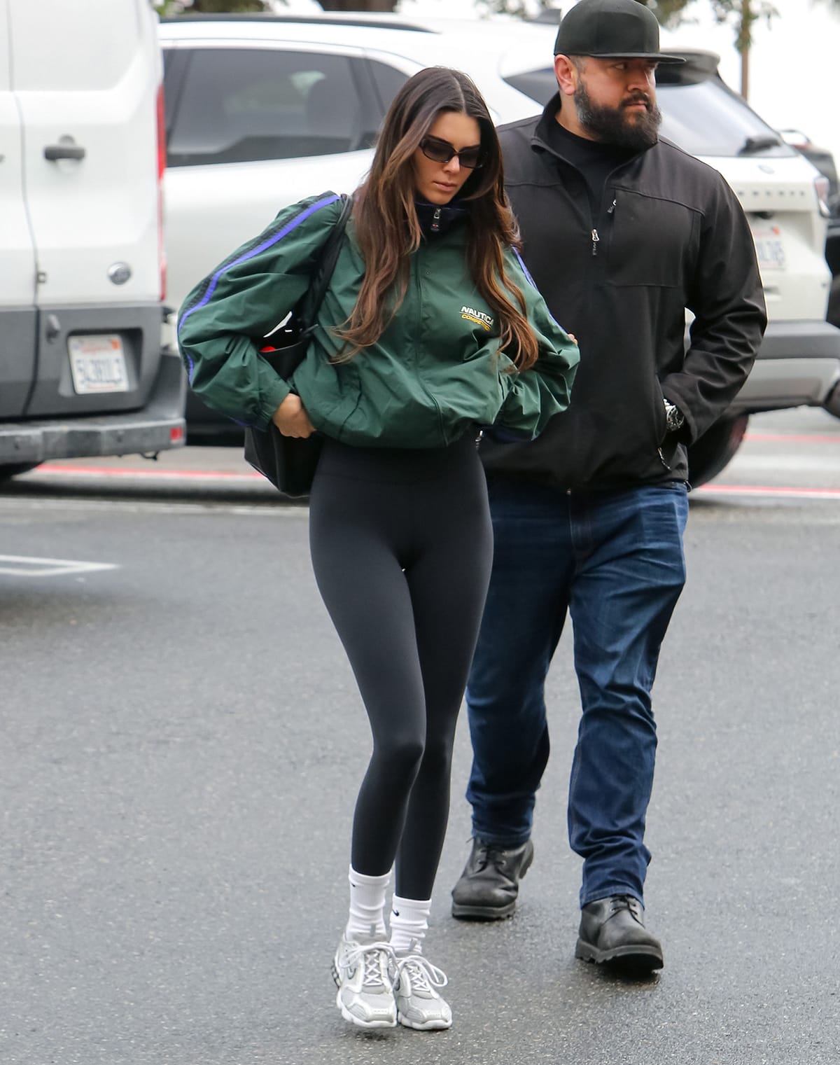 Kendall Jenner heads to Pilates class in a vintage Nautica Competition green crop jacket and Alo leggings on January 5, 2023