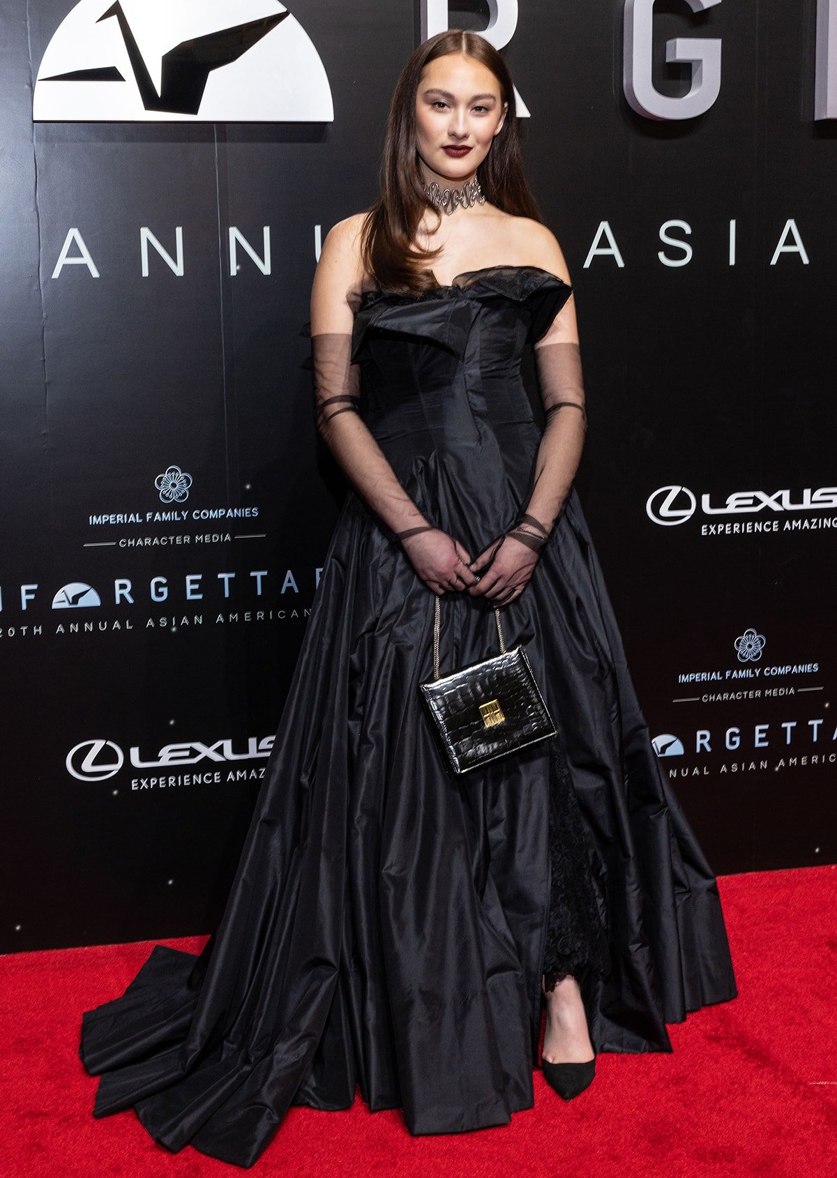 Lola Tung wearing a vintage Yohji Yamamoto Spring 1999 gown with a Chris Habana tribal thorn choker at the Unforgettable: The 20th Annual Asian American Awards held at the Beverly Hilton Hotel on December 18, 2022