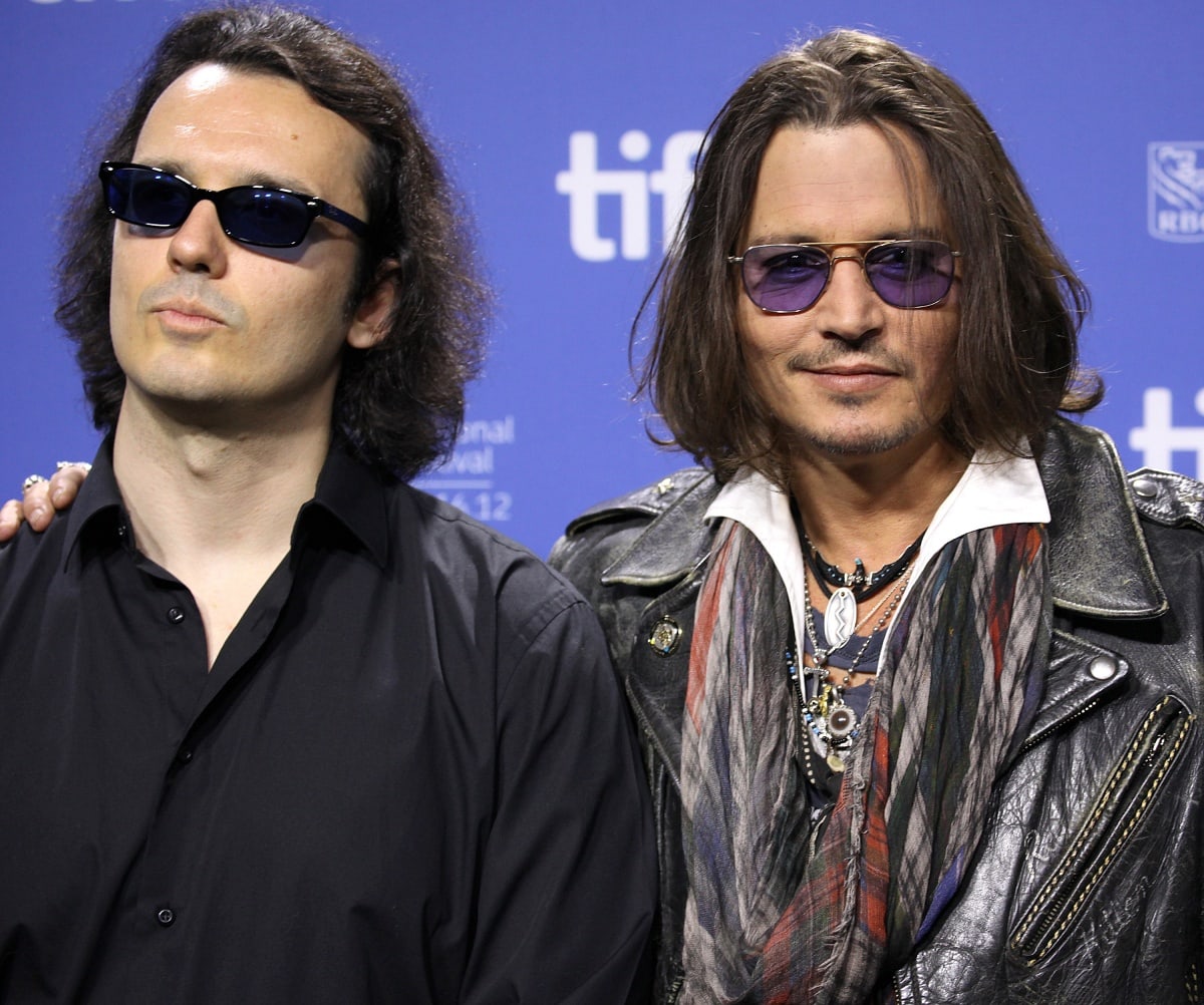 Damien Echols with Johnny Depp at the West of Memphis photo call during the Toronto International Film Festival