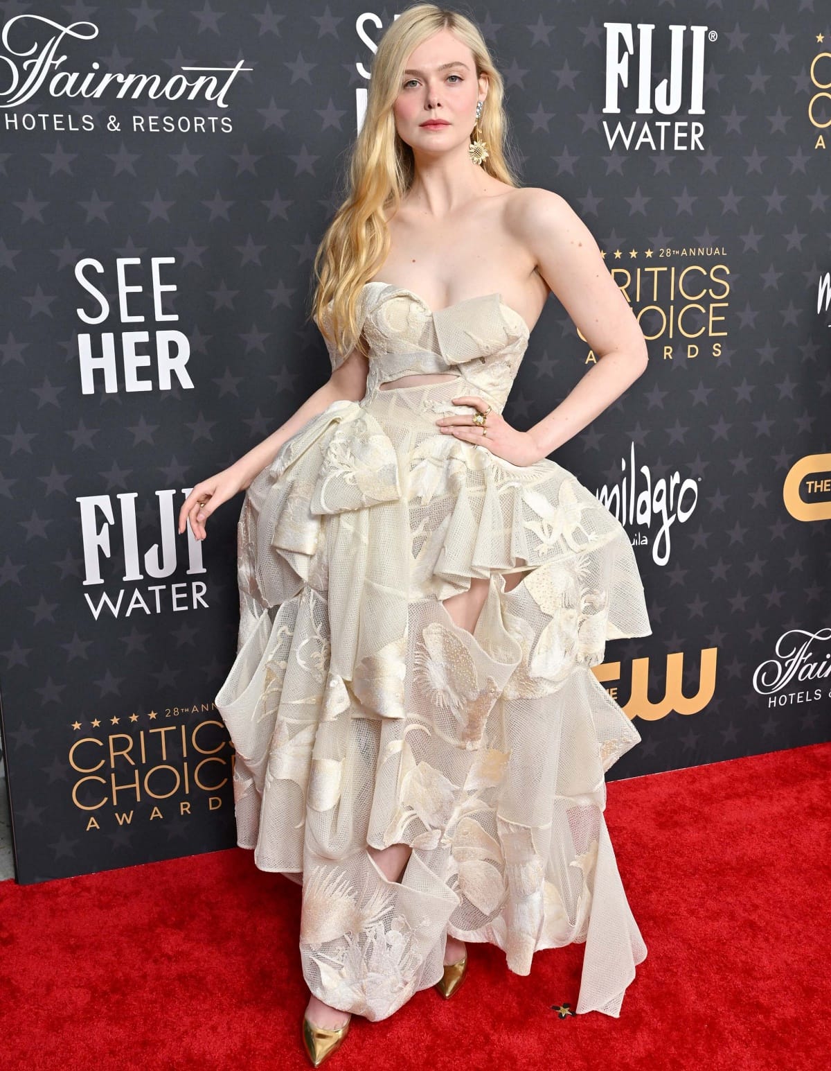 Elle Fanning turning heads in an Alexander McQueen dress with Gianvito Rossi pumps