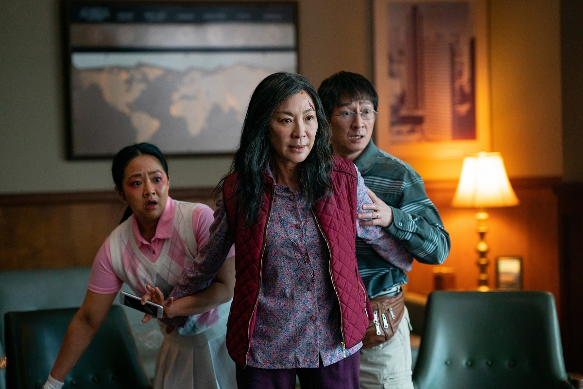 Stephanie Hsu as Joy Wang, Michelle Yeoh as Evelyn Wang, and Ke Huy Quan as Waymond Wang in the 2022 absurdist comedy-drama film Everything Everywhere All at Once