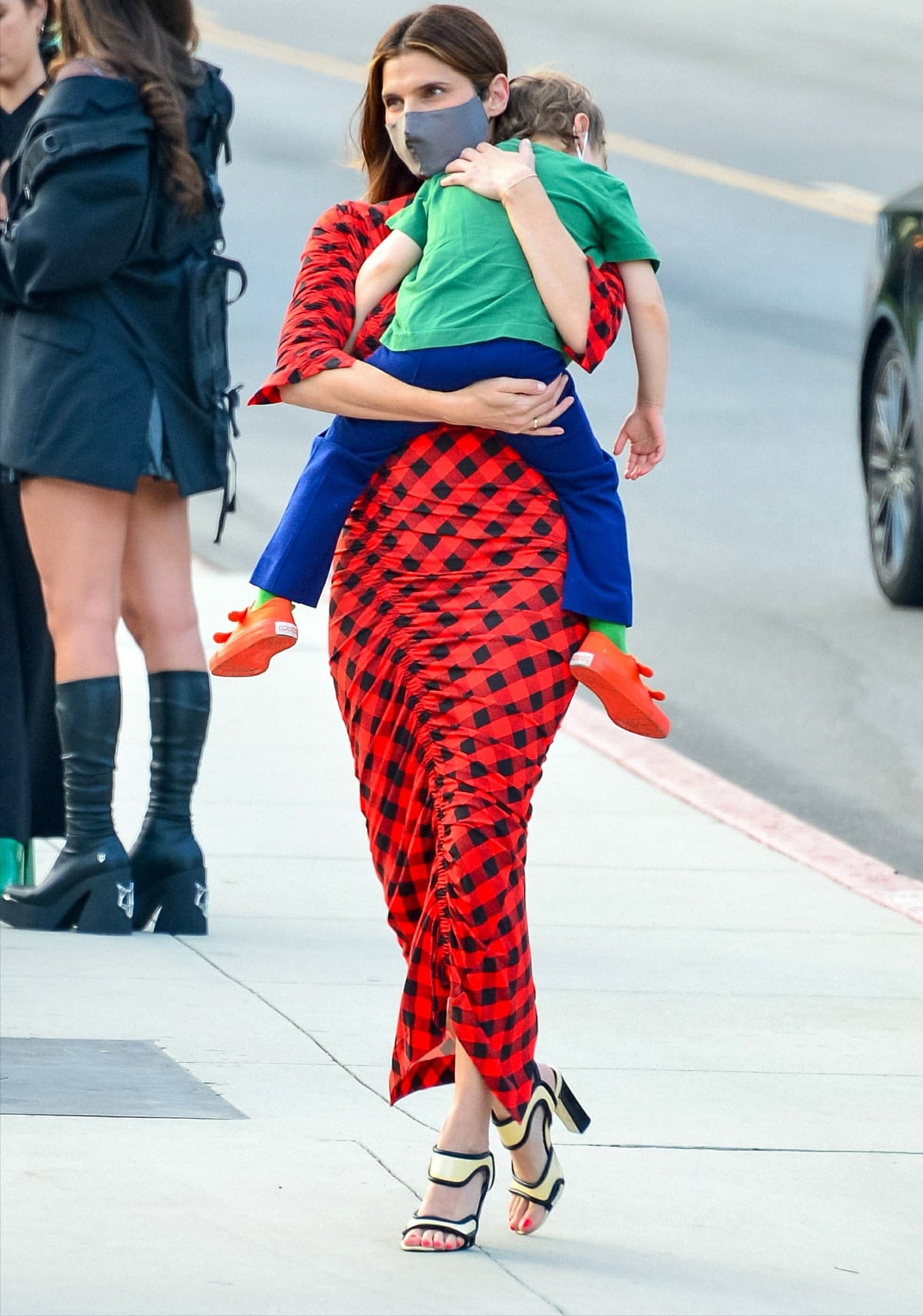 Lake Bell arriving with her son, Ozgood Campbell, at the premiere of Cinderella