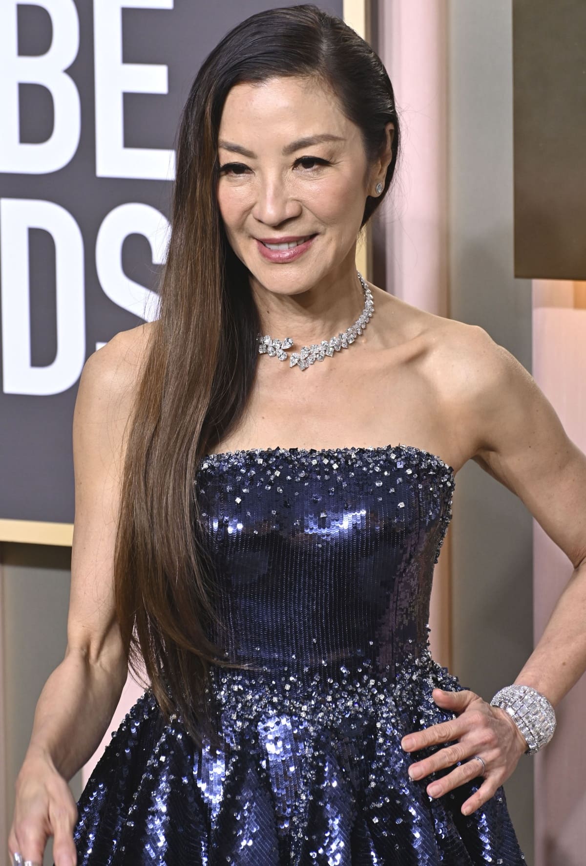 Glittering in a sequined Armani Prive gown, Michelle Yeoh stepped out for the 80th Annual Golden Globe Awards