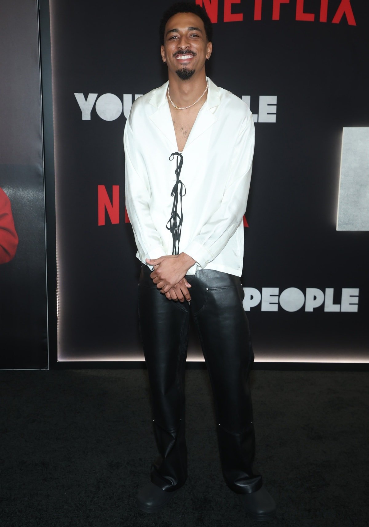 Travis Bennett was all smiles as he stepped out on the black carpet at the Los Angeles premiere of You People