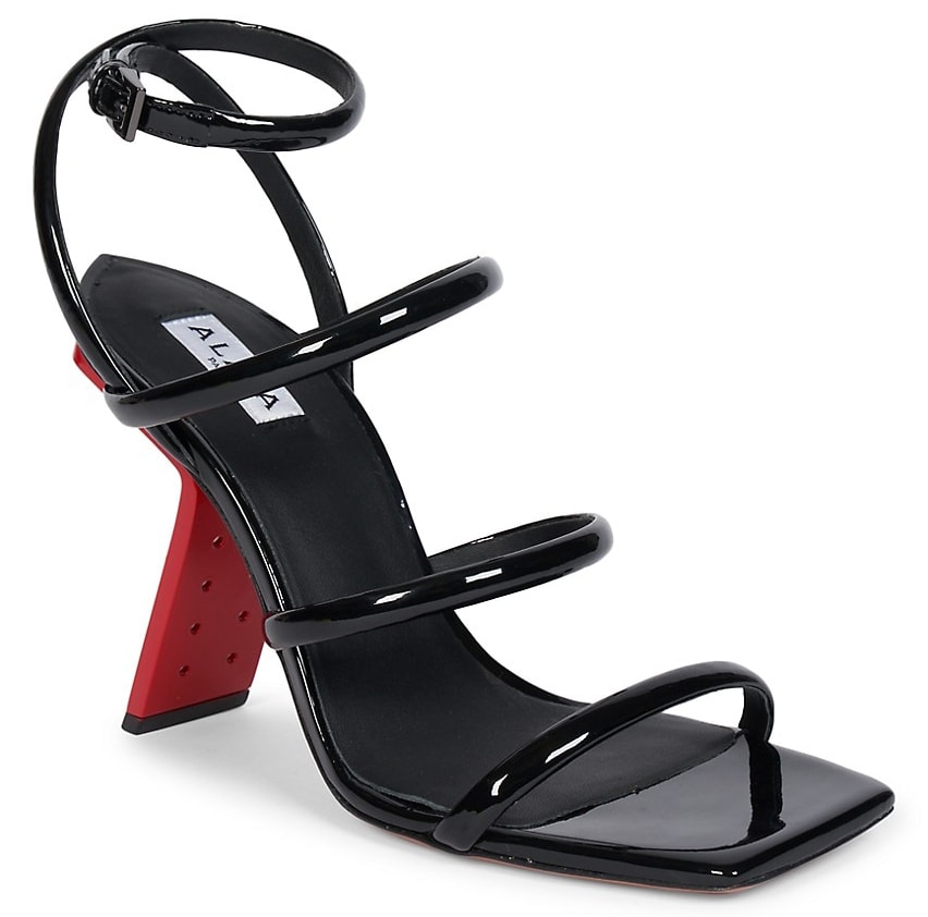 The Alaia Perfo heels have patent leather vamp straps, square open toes, and sculpted metal heels